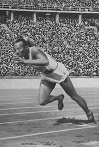 Jesse Owens racing in 1936 Olympics in Berlin.