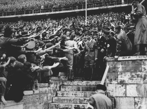 Crowds salute Hitler at Olympics stadium.